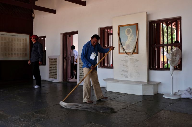 © Reuters. A worker mops the floor inside Gandhi Ashram, where U.S. President Donald Trump is expected to visit, in Ahmedabad