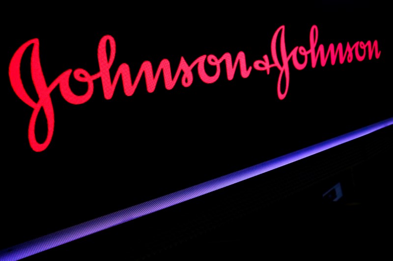 © Reuters. FILE PHOTO: The Johnson & Johnson logo is displayed on a screen on the floor of the NYSE in New York