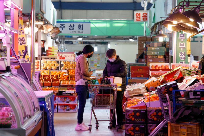 South Korea vows to calm markets, sees virus slamming economic data