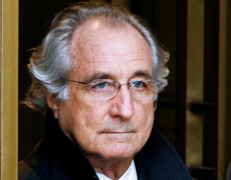 © Reuters. FILE PHOTO: File photo of Bernard Madoff exiting the Manhattan federal court house in New York