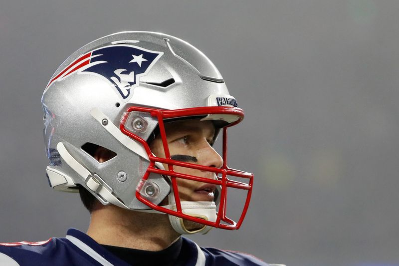&copy; Reuters. FILE PHOTO: Former New England Patriots quarterback Tom Brady (12) during a playoff game against the Tennessee Titans