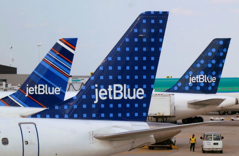 &copy; Reuters. FILE PHOTO: JetBlue Airways aircrafts are pictured at departure gates at John F. Kennedy International Airport in New York