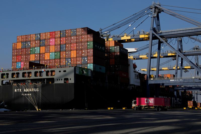 © Reuters. FILE PHOTO: Shipping containers are stacked on a ship docked at Yusen Terminals at the Port of Los Angeles