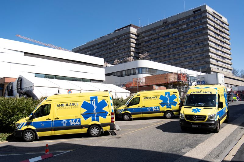 © Reuters. FILE PHOTO: Ambulances are pictured in front of a temporary space for patients at the CHUV in Lausanne