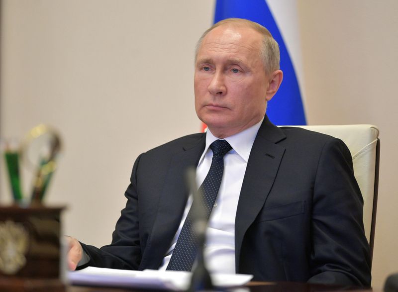 &copy; Reuters. Russian President Putin chairs a meeting via video link outside Moscow