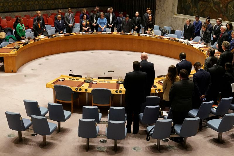 © Reuters. FILE PHOTO: Members of the United Nations Security Council observe a moment of silence at the beginning of a meeting about Afghanistan at United Nations Headquarters in the Manhattan borough of New York City