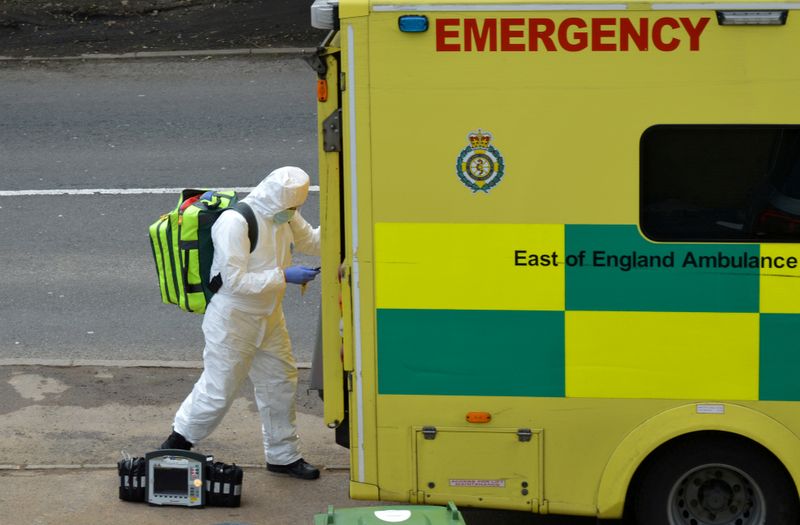 &copy; Reuters. FILE PHOTO: A paramedic is seen in Cheshunt at the back of an ambulance as the spread of the coronavirus disease (COVID-19) continues