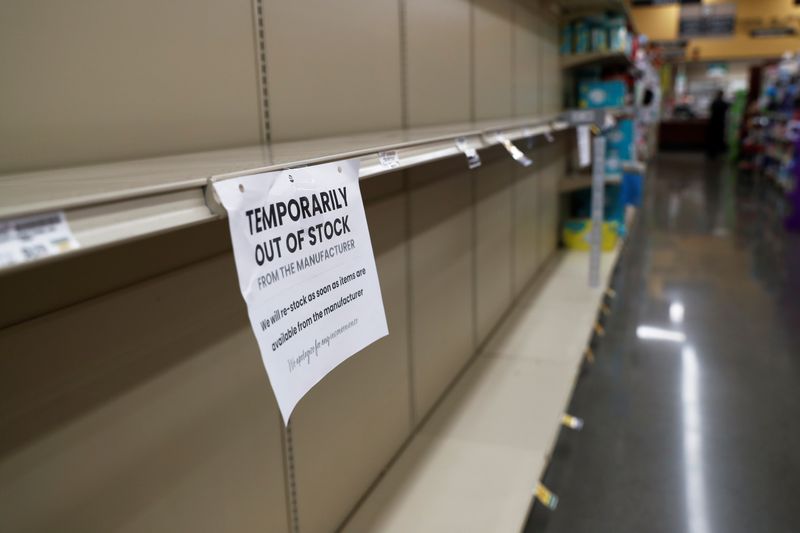 &copy; Reuters. A sign hangs from empty shelves, prior to California&apos;s Governor Gavin Newsom&apos;s effective immediately statewide &quot;stay at home order”, in the face of the fast-spreading pandemic coronavirus (COVID-19), Safeway supermarket in Napa, Californi