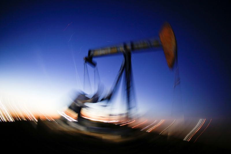 &copy; Reuters. FILE PHOTO:  A long exposure image shows the movement of a crude oil pump jack in the Permian Basin in Loving County