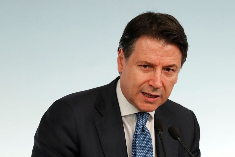 &copy; Reuters. FILE PHOTO: Italian Prime Minister Giuseppe Conte speaks to media as he announces a decree that will close cinemas, schools in order to contain the coronavirus, in Rome