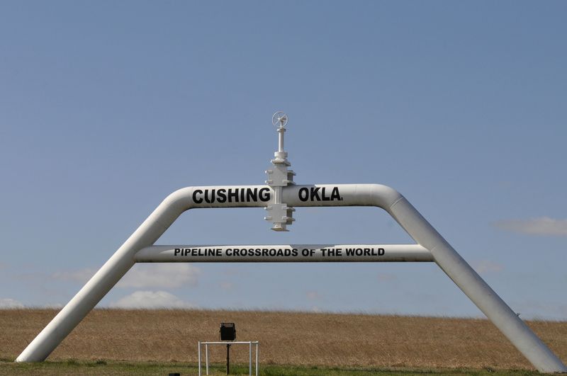 &copy; Reuters. FILE PHOTO: A sign built out of pipeline, which reads &quot;pipeline crossroads of the world&quot; welcomes visitors to Cushing, Oklahoma