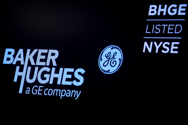 &copy; Reuters. A screen displays the logo for Baker Hughes, a GE company on the floor at the NYSE in New York