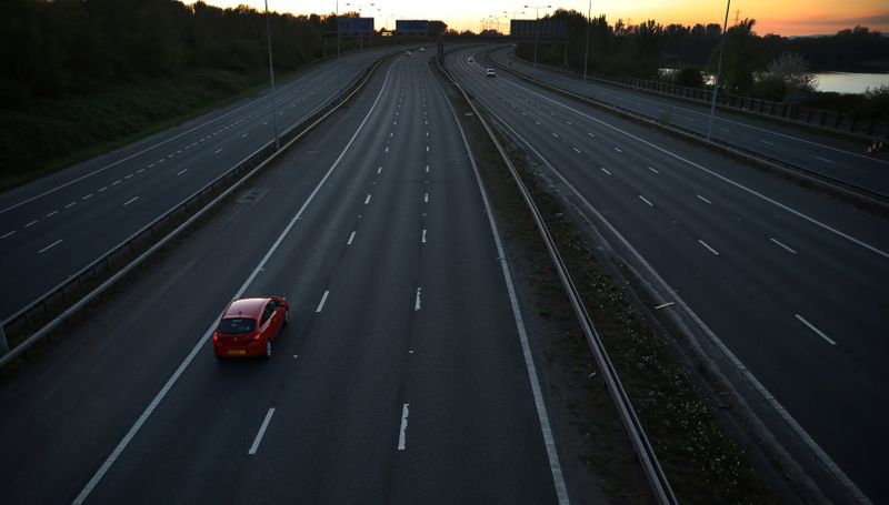 &copy; Reuters. A car travels along a deserted stretch of the M60 motorway, as the spread of the coronavirus disease (COVID-19) continues, Manchester, Britain