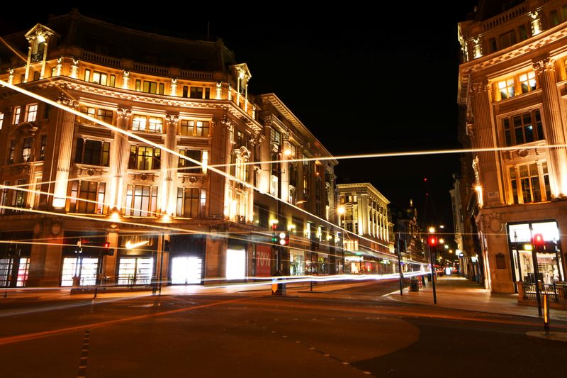 &copy; Reuters. The light trails of buses are seen driving through a quiet Oxford Circus during the late evening in London