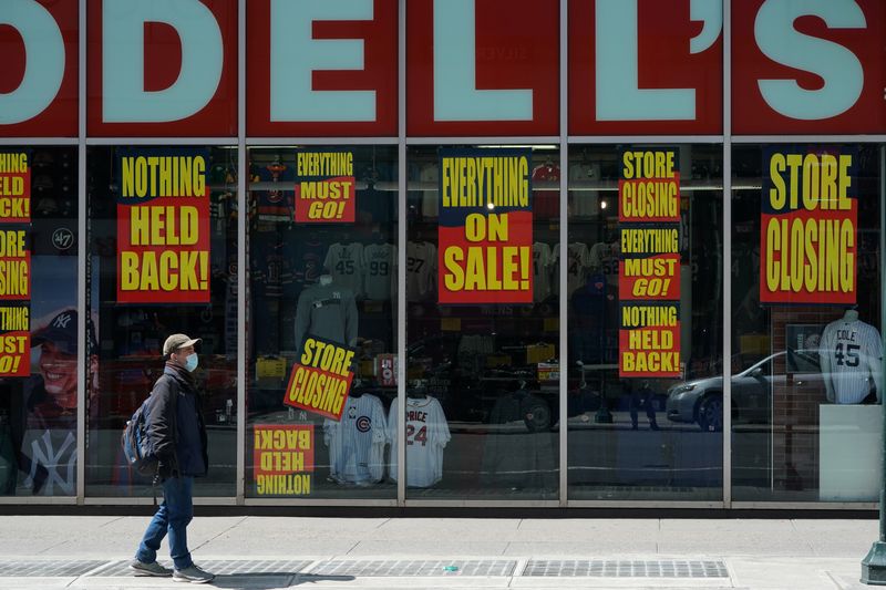 &copy; Reuters. A man stands in front of a Modell&apos;s store that is closed, as retail sales suffer record drop during the outbreak of the coronavirus disease (COVID19) in New York