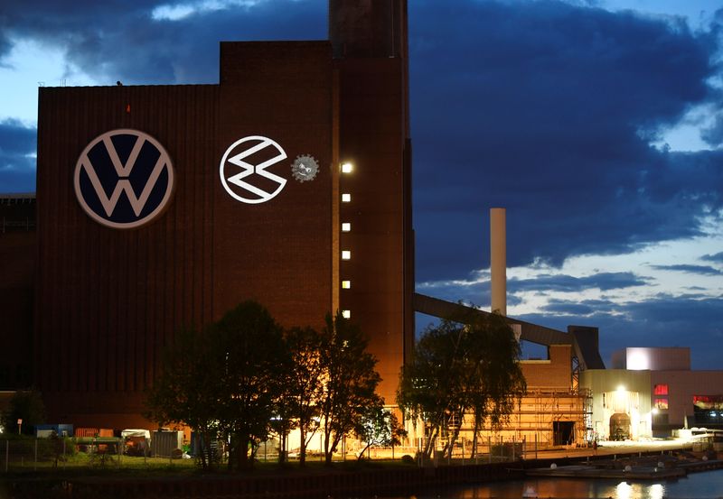 &copy; Reuters. A cartoon of a VW logo squashing the coronavirus is displayed on a building at Volkswagen&apos;s headquarters to celebrate the plant&apos;s re-opening during the spread of the coronavirus disease (COVID-19) in Wolfsburg