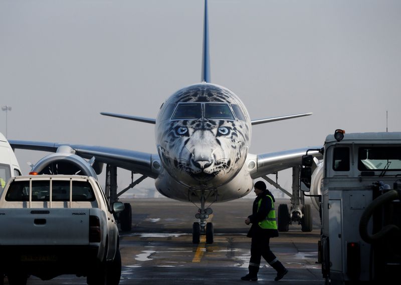 © Reuters. Air Astana Embraer E190-E2 aircraft with a snow leopard livery is seen at Almaty International Airport
