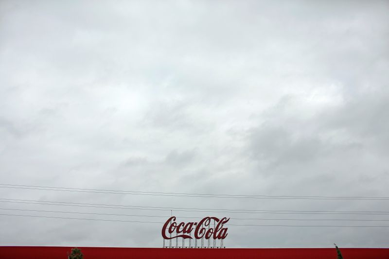 © Reuters. FILE PHOTO: Coca-Cola signage is pictured at a bottling plant near Seville