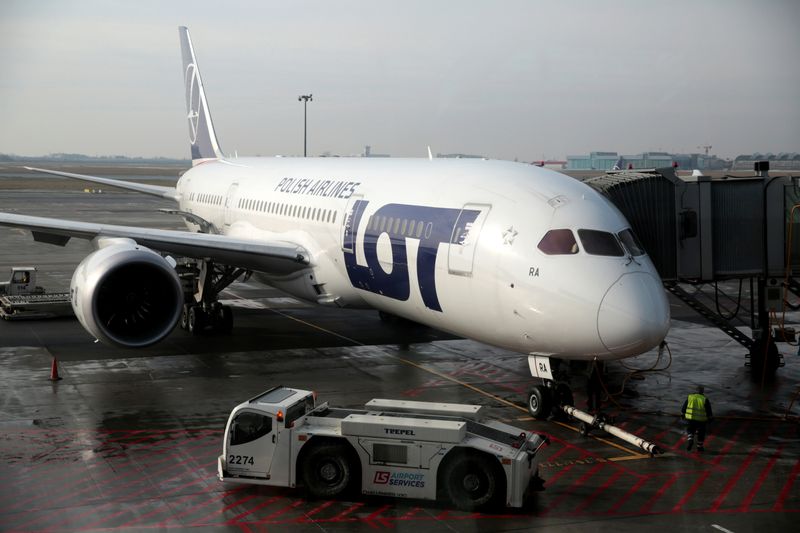 &copy; Reuters. FILE PHOTO: A Boeing 787 Dreamliner jet operated by Polish airline LOT pictured through the window at Chopin airport in Warsaw