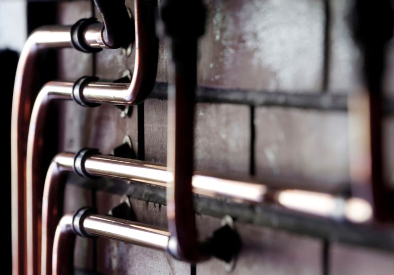 &copy; Reuters. FILE PHOTO: Copper pipes are pictured during a double distillation at a distillery in France