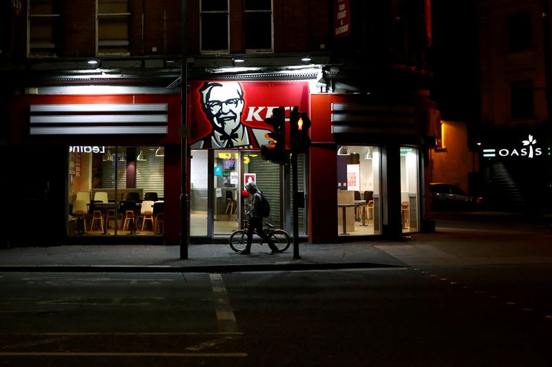 &copy; Reuters. FILE PHOTO: A person walks past an empty KFC restaurant in Belfast