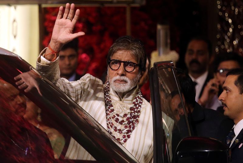 &copy; Reuters. Bollywood actor Amitabh Bachchan leaves after attending the wedding ceremony of Isha Ambani in Mumbai