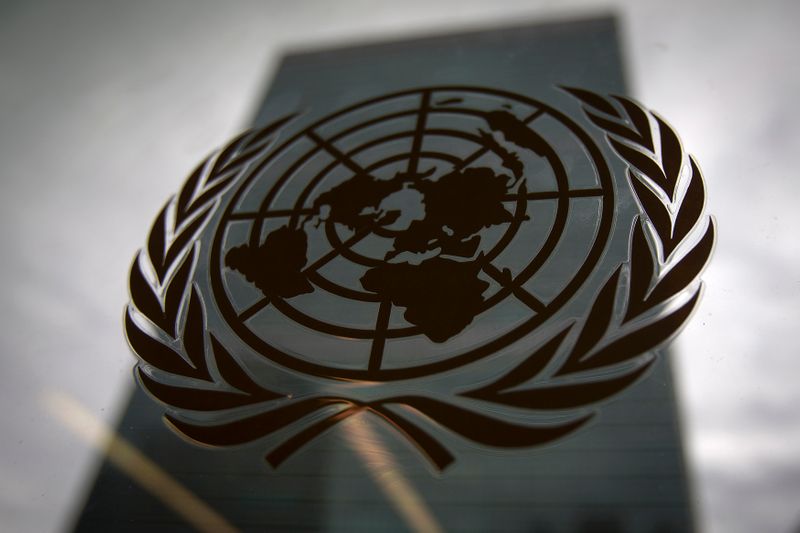 &copy; Reuters. The United Nations headquarters building is pictured though a window with the UN logo in the foreground in the Manhattan borough of New York