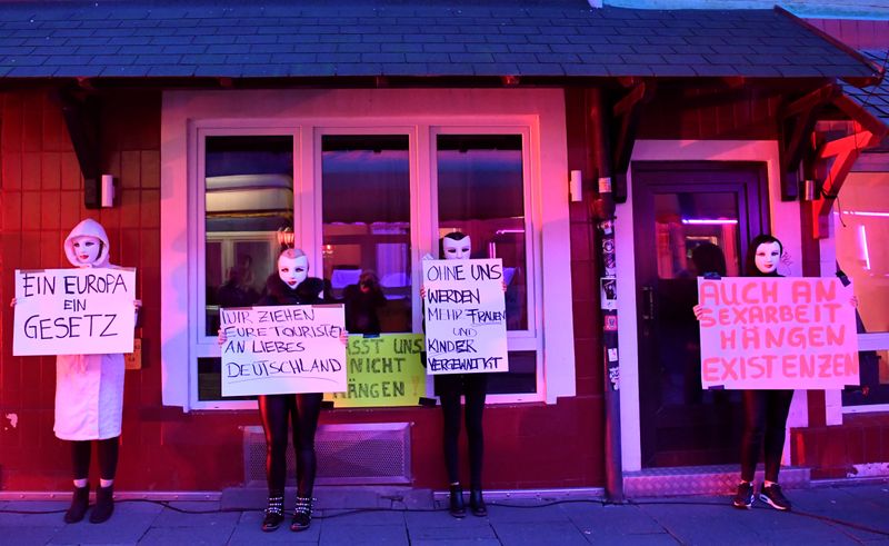 © Reuters. Prostitutes hold a rally in Hamburg demanding the reopening of Germany's brothels