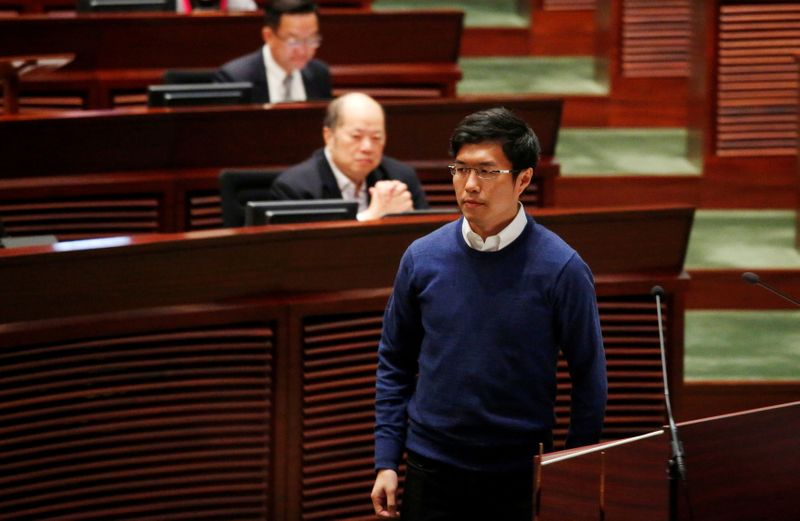 &copy; Reuters. FILE PHOTO: Newly-elected lawmaker Au Nok-hin walks after swearing in at the Legislative Council in Hong Kong, China