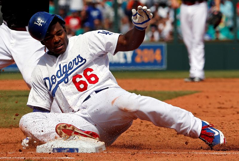 &copy; Reuters. FILE PHOTO: Los Angeles Dodgers&apos; Puig reacts after being tagged out by Arizona Diamondbacks&apos; Hill during their Major League Baseball game in Sydney