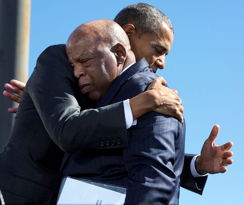 © Reuters. U.S. President Barack Obama hugs Rep. John Lewis in Selma