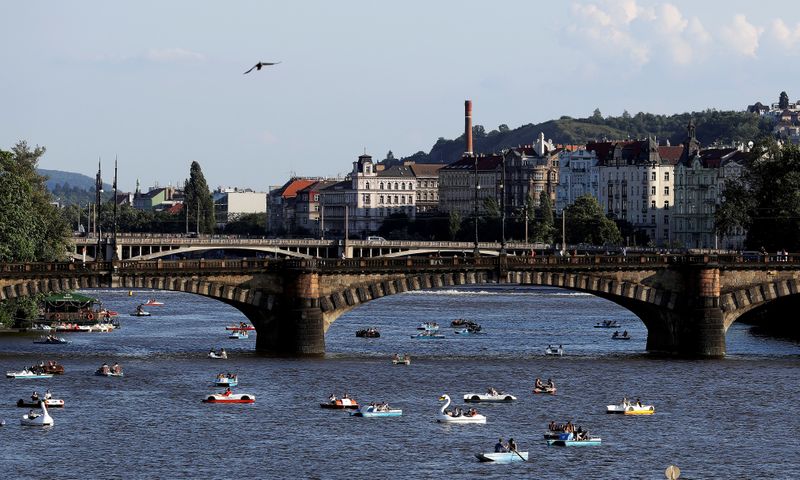 &copy; Reuters. FILE PHOTO: People ride pedal boats on the Vltava river in Prague
