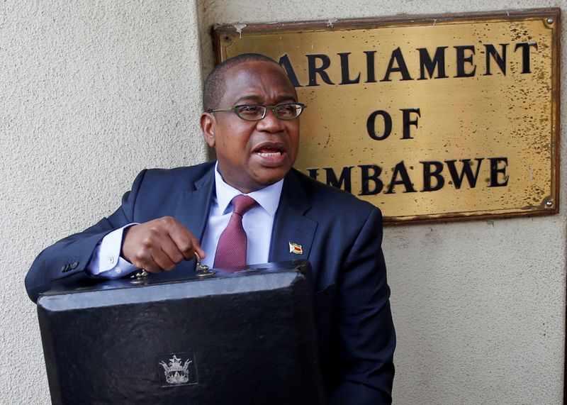 © Reuters. Zimbabwe Finance Minister Mthuli Ncube arrives to present the 2020 National Budget at Parliament Building in Harare