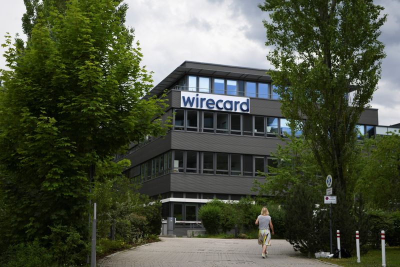 &copy; Reuters. FILE PHOTO: A woman enters the headquarters of Wirecard AG in Aschheim