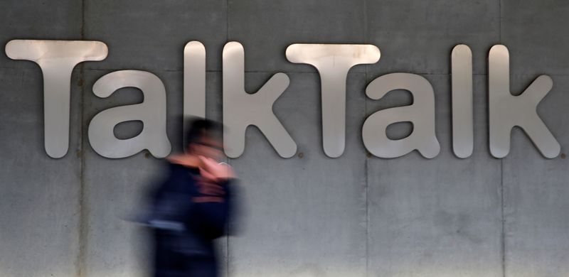 Â© Reuters. FILE PHOTO: File photograph of a man walking past a company logo outside a TalkTalk building in London