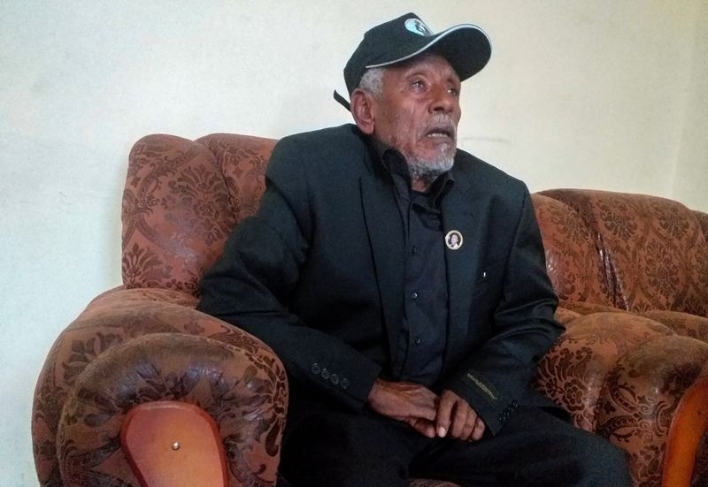 © Reuters. Hundeessaa Bonsa, father to the slain Ethiopian political singer Haacaaluu Hundeessaa talks during a Reuters interview at their home in Ambo