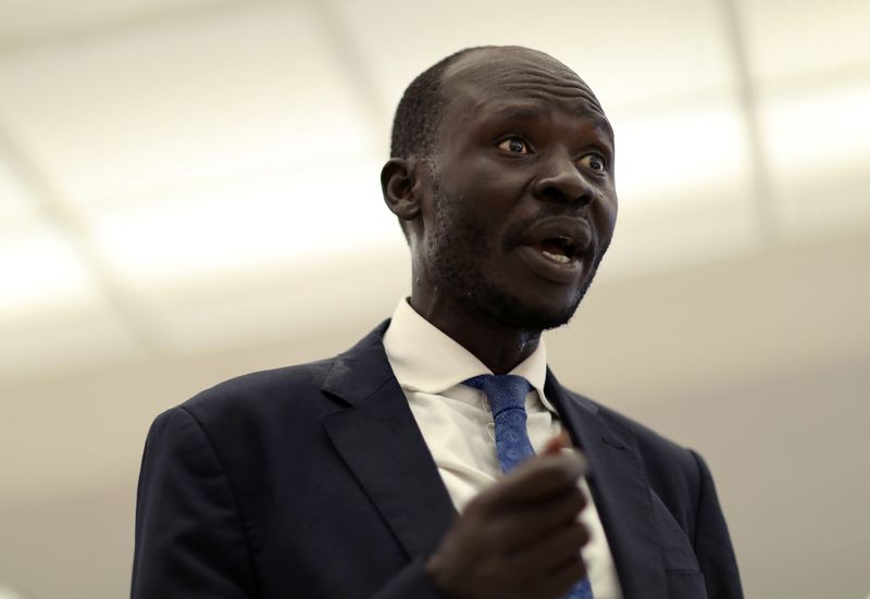 © Reuters. South Sudan's Peter Biar Ajak arrives in Dulles International Airport, US, after fleeing Kenya