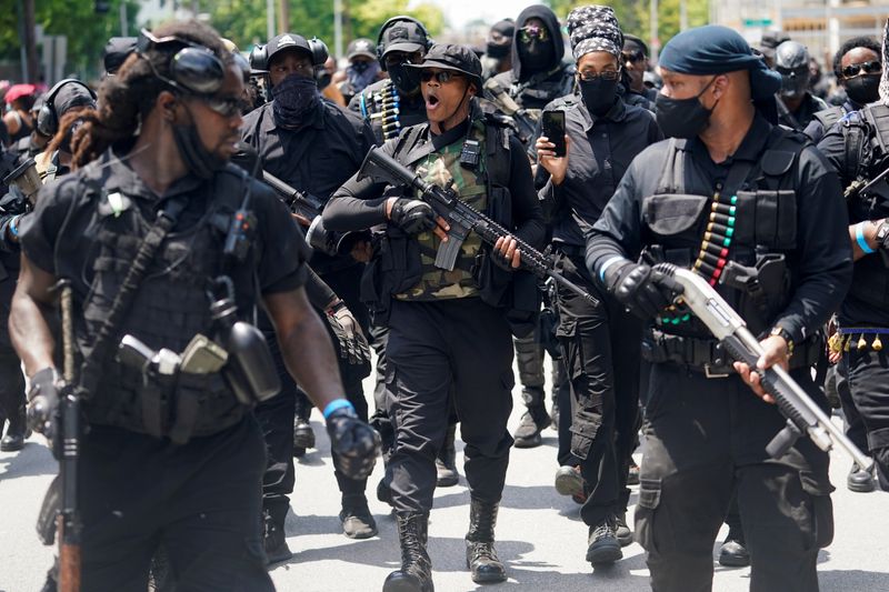 &copy; Reuters. Members and supporters of an all-Black militia group called NFAC hold an armed rally in Louisville