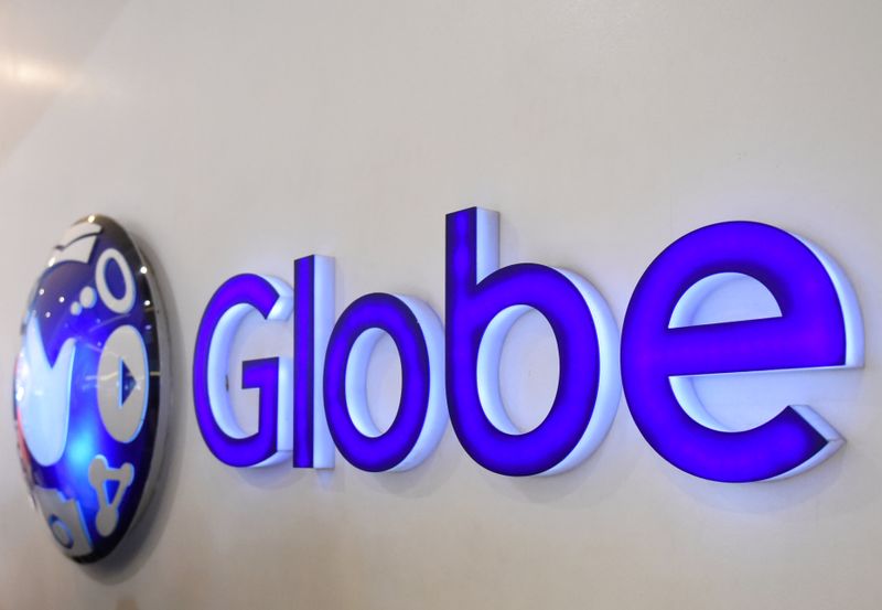 &copy; Reuters. A logo of Globe Telecom is seen at a Globe service center in Edsa, Quezon City, metro Manila