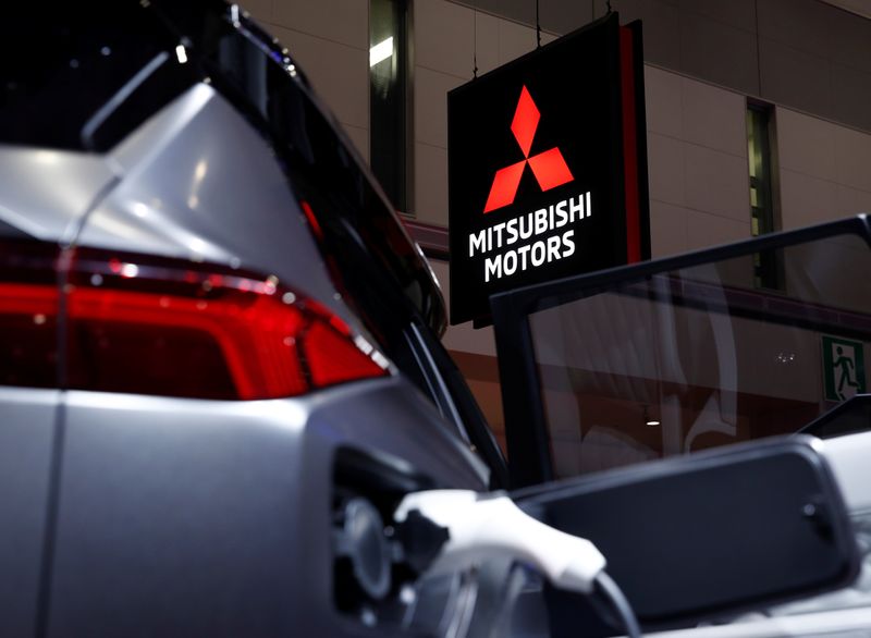&copy; Reuters. A Mitsubishi Motors signage is pictured next to a Mitsubishi electric car at the Tokyo Motor Show