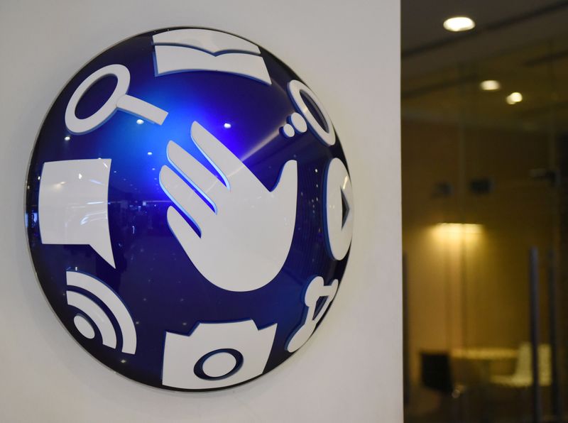 &copy; Reuters. A logo of Globe Telecom is seen at a Globe service center in Edsa, Quezon City, metro Manila