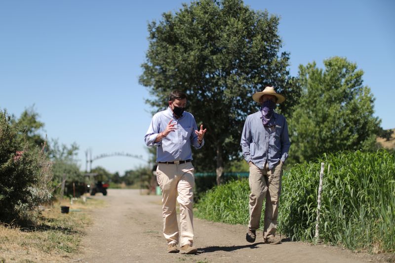 &copy; Reuters. Head of School Christopher Barnes walks through the campus of Midland School with Farm Manager Nick Tranmer, as the global outbreak of the coronavirus disease (COVID-19) continues, in Los Olivos
