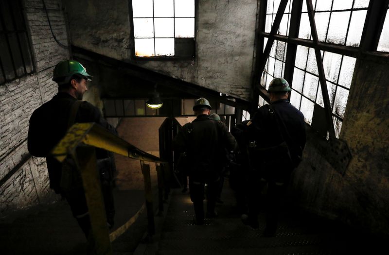 &copy; Reuters. FILE PHOTO: Miners walk inside Wieczorek Coal Mine in Katowice, Poland