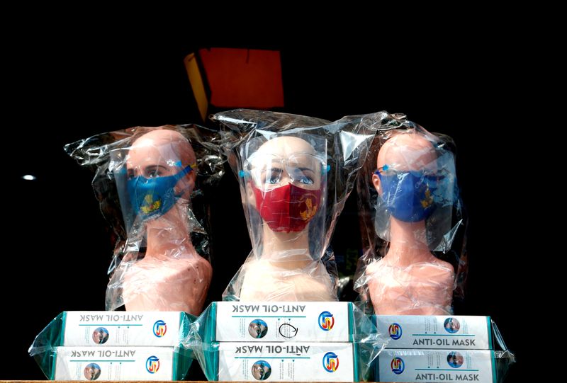 &copy; Reuters. Mannequins wearing protective face masks and face shields are displayed at a market amid the coronavirus disease (COVID-19) outbreak in Jakarta