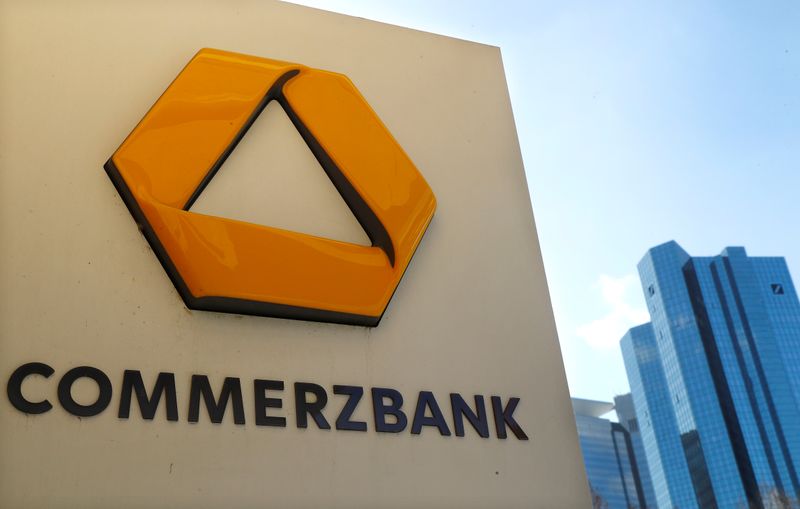 &copy; Reuters. A sign for an ATM of Commerzbank is seen next to the headquarters of Deutsche Bank (R) in Frankfurt
