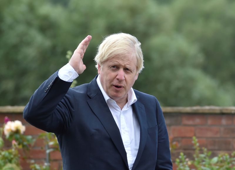 &copy; Reuters. Britain&apos;s Prime Minister Boris Johnson speaks to local people at the Canal Side Heritage Centre in Beeston