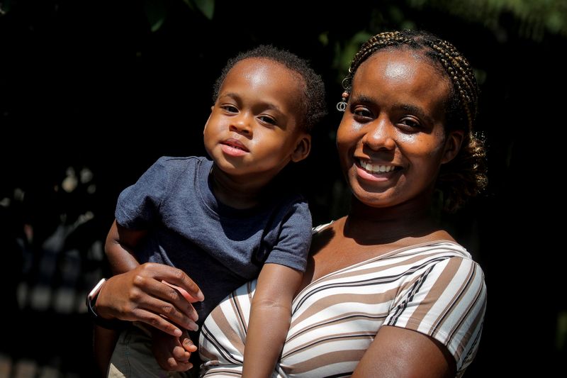 &copy; Reuters. FILE PHOTO: Chantel Springer poses with her son Jasiah in the Brooklyn borough of New York