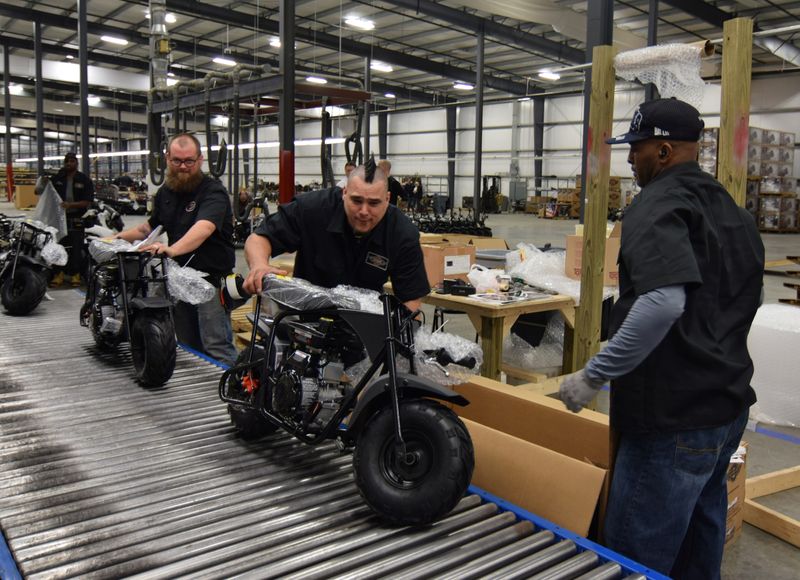 &copy; Reuters. Workers construct mini-bikes at motorcycle and go-kart maker Monster Moto in Ruston