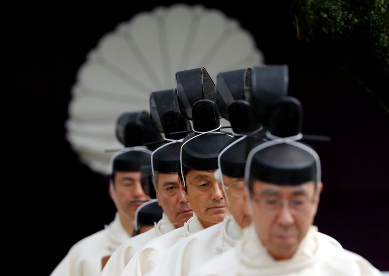 &copy; Reuters. FILE PHOTO: Japanese Shinto priests attend a ritual during an autumn festival at Yasukuni Shrine in Tokyo