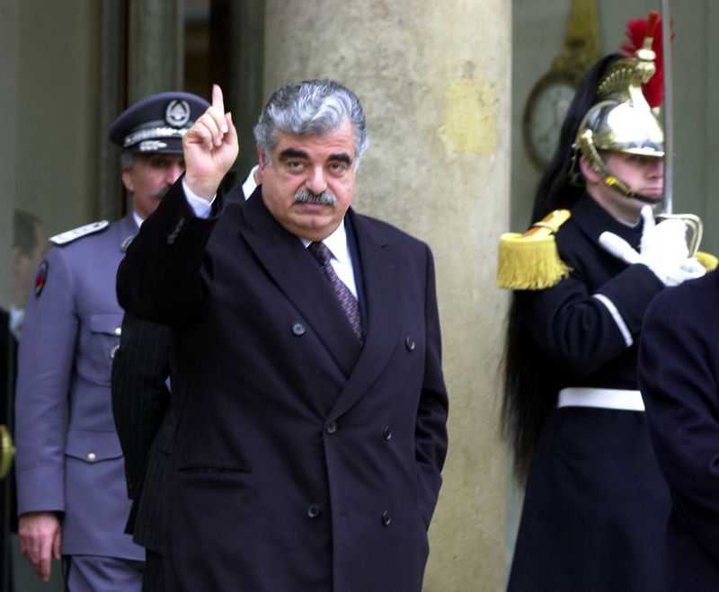 &copy; Reuters. FILE PHOTO: Lebanese Prime Minister Rafik Hariri leaves the Elysee Palace following a meeting with French President Jacques Chirac in Paris